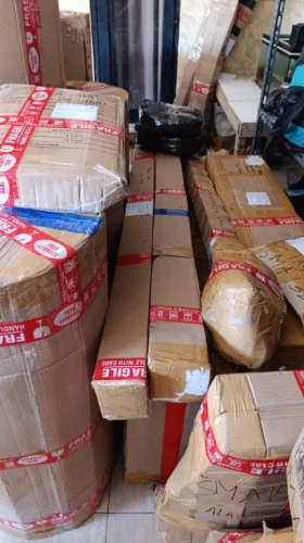 Packing dan pengiriman pesanan Drumband Juara